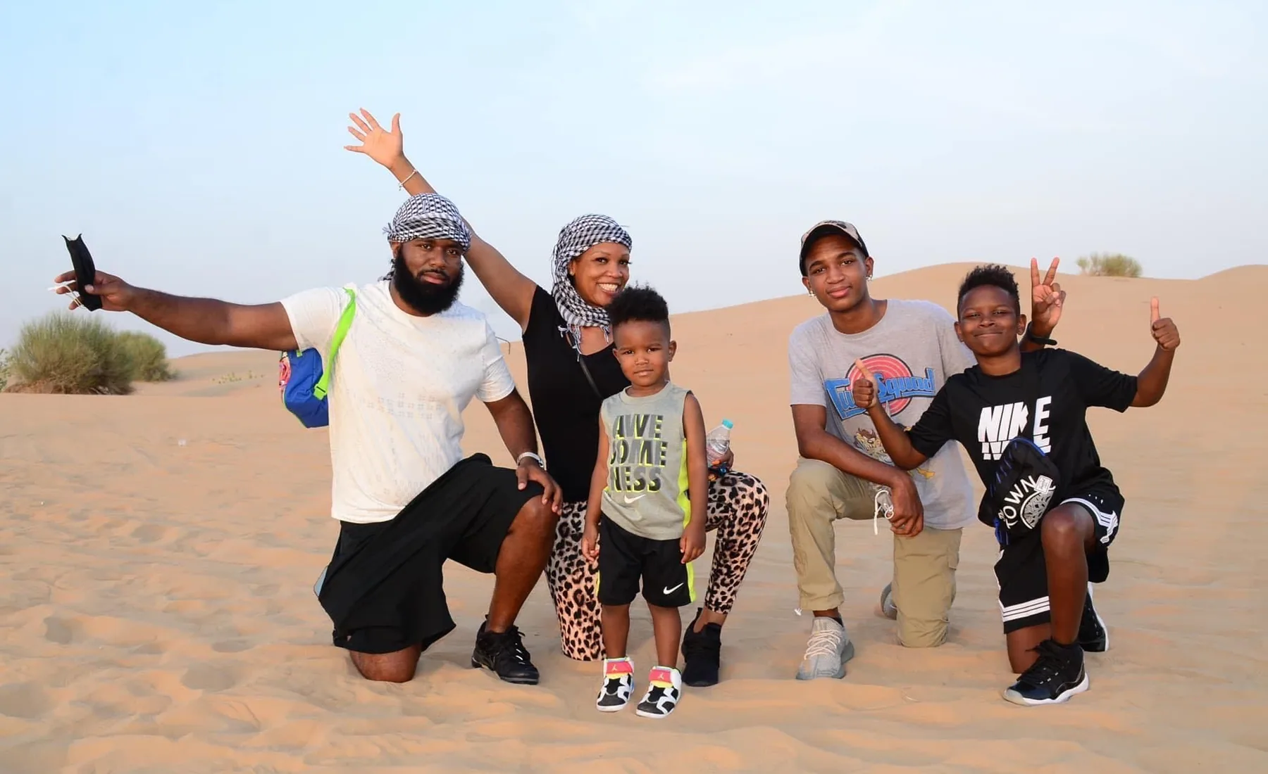 Cruz and his family posing together during a city adventure